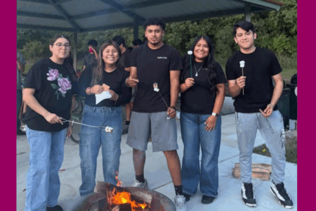 group of male and female teenagers from catholic youth group in south omaha roasting smores